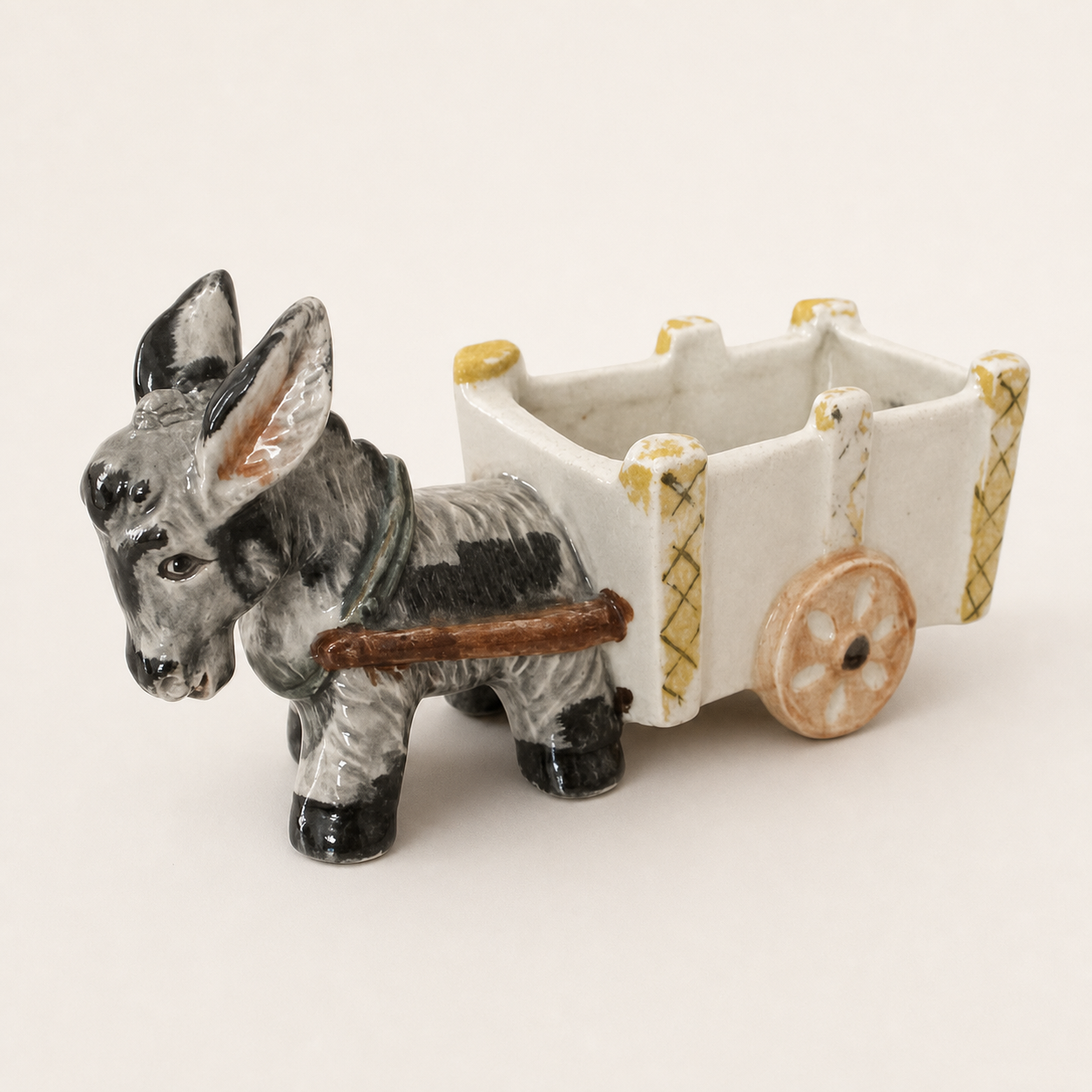 Vintage Japanese ceramic donkey cart planter, side inspection view on white